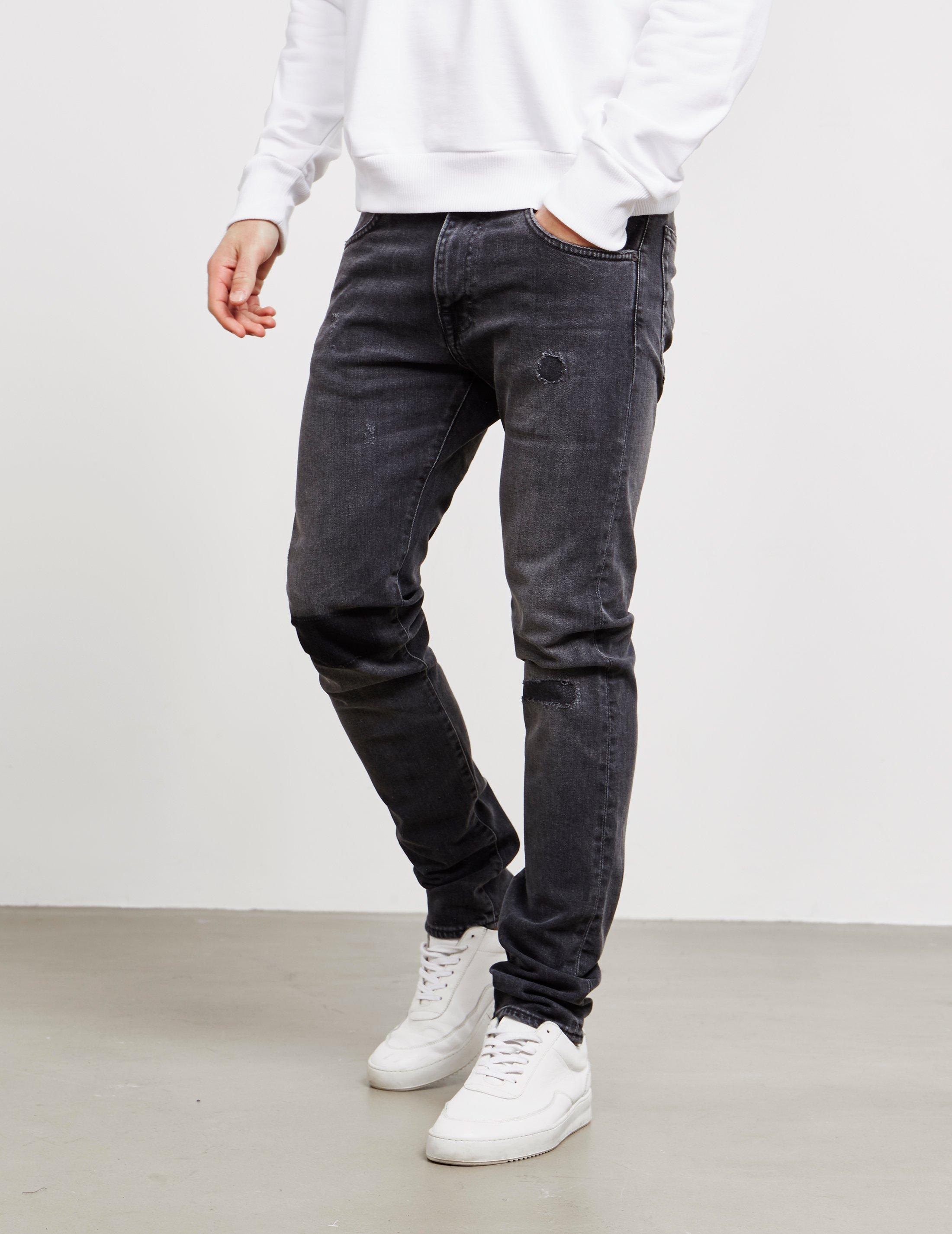mens black ripped tapered jeans