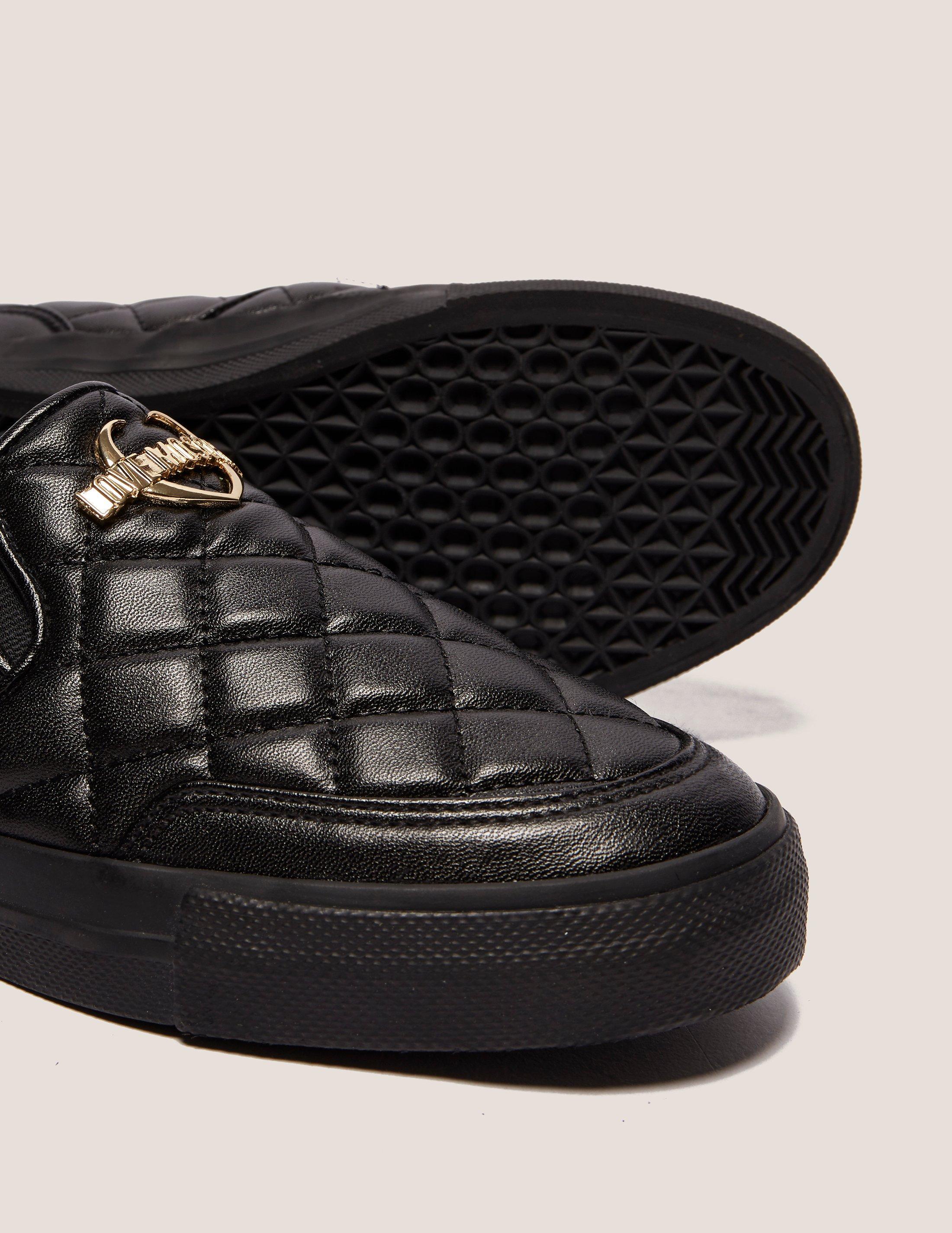 women's black quilted slip on sneakers