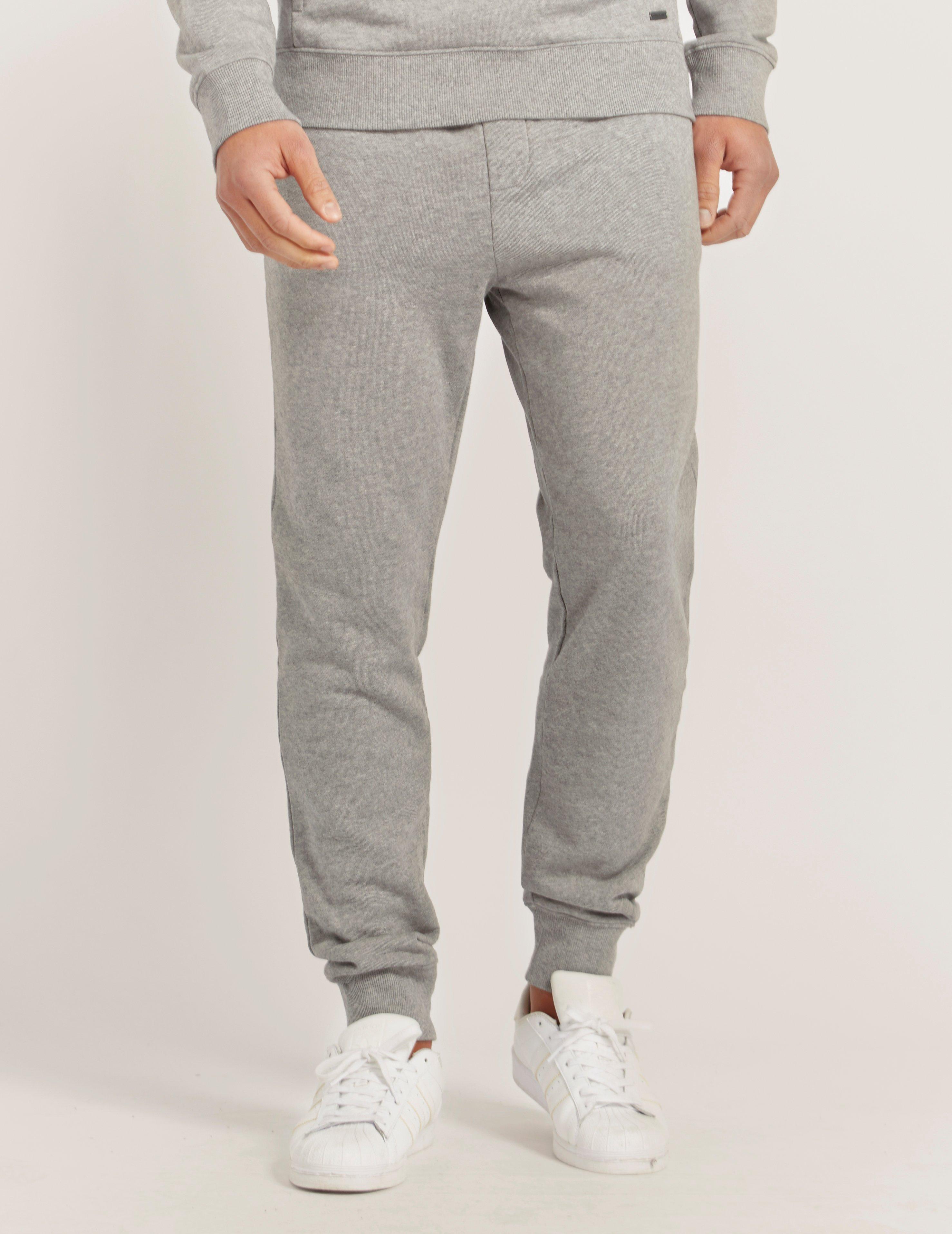 grey and orange track pants