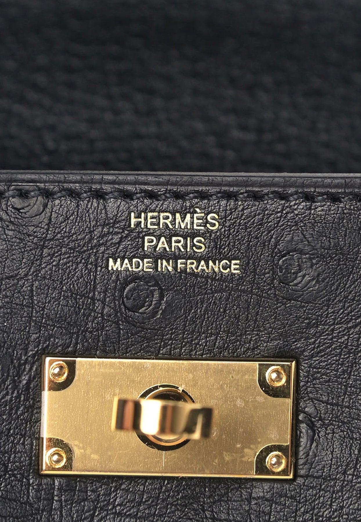 Hermès Kelly To Go Wallet In Black Ostrich With Gold Hardware in White