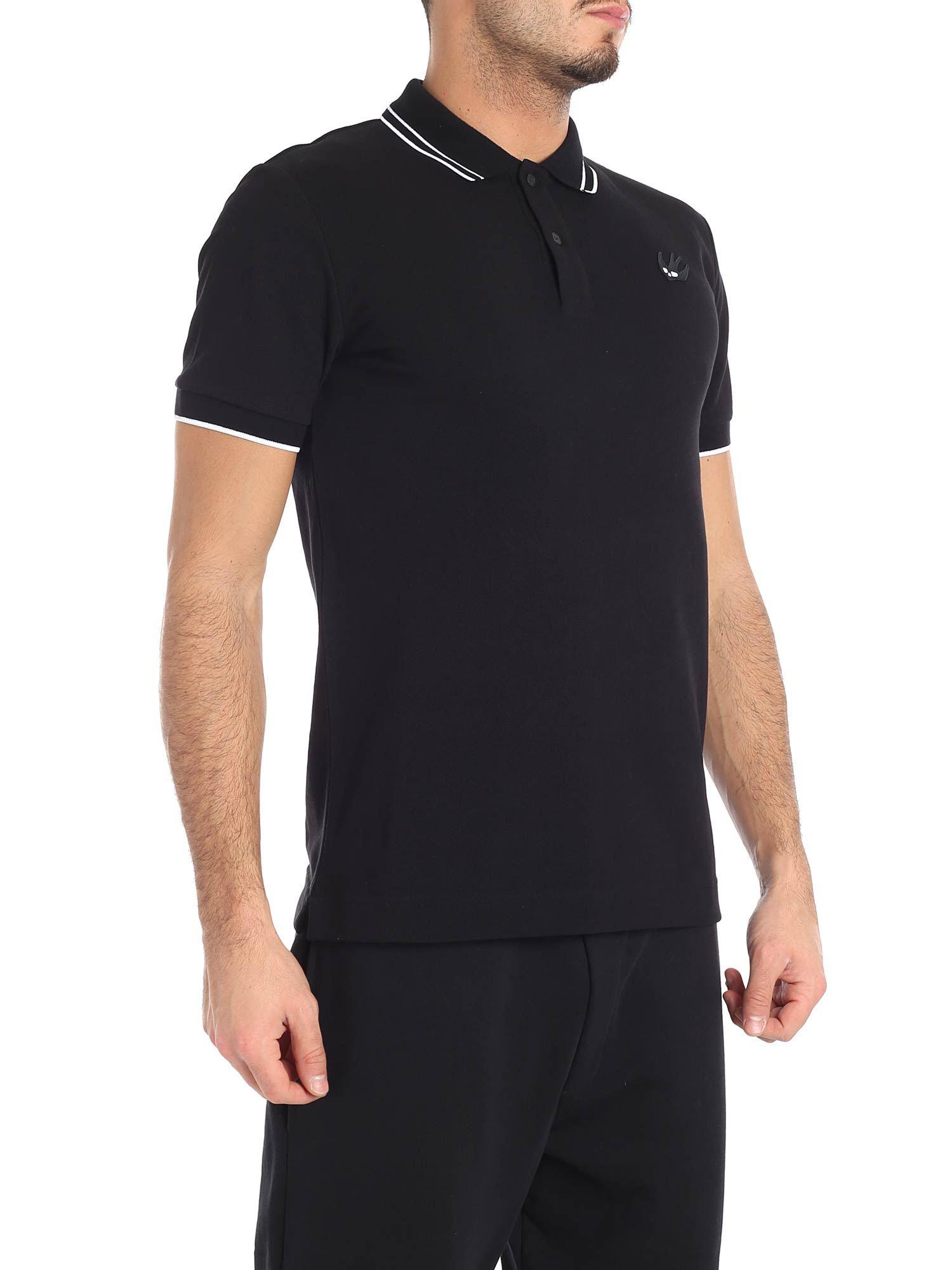 black polo shirt with white trim