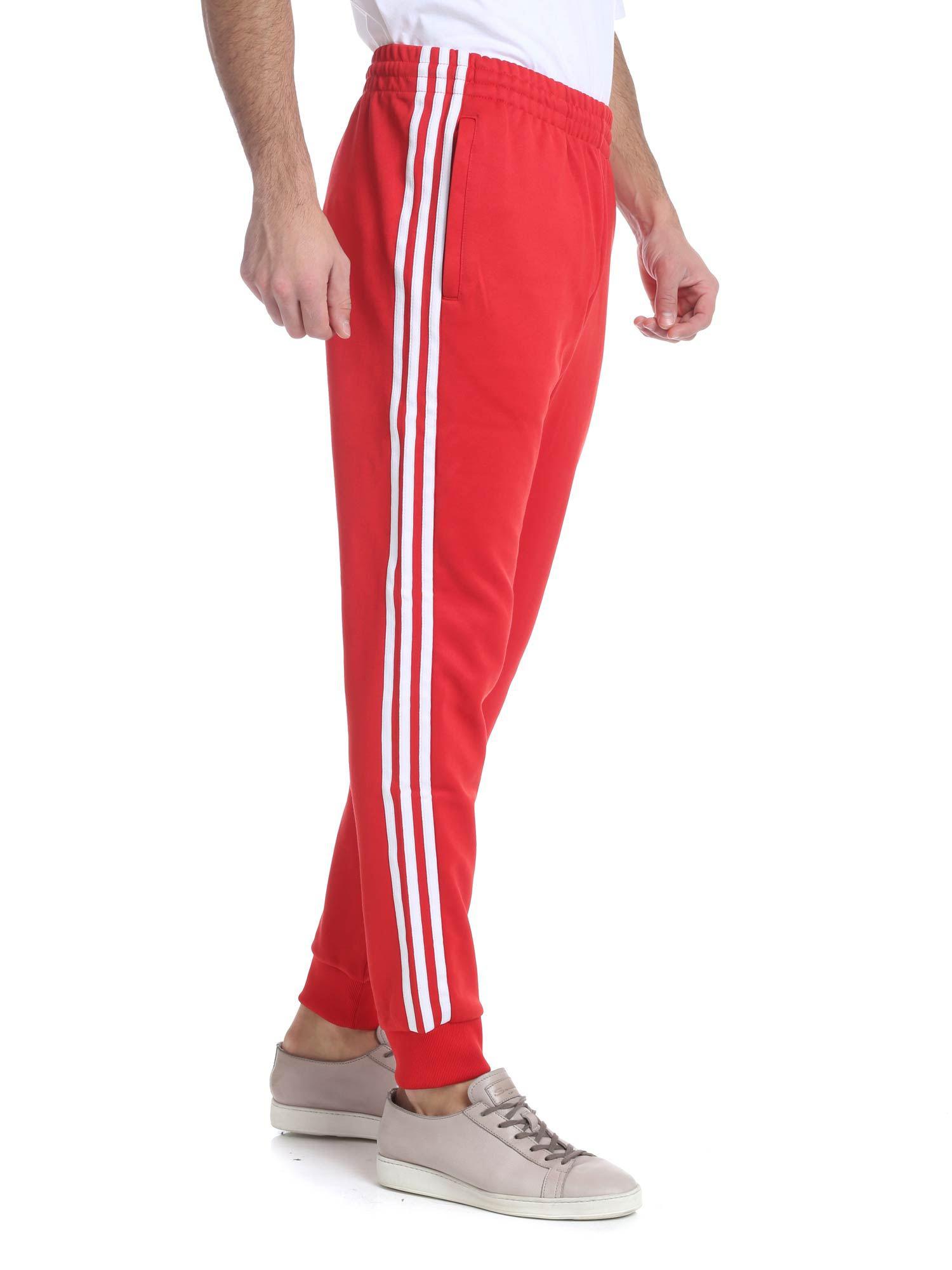 adidas sst track pants mens red