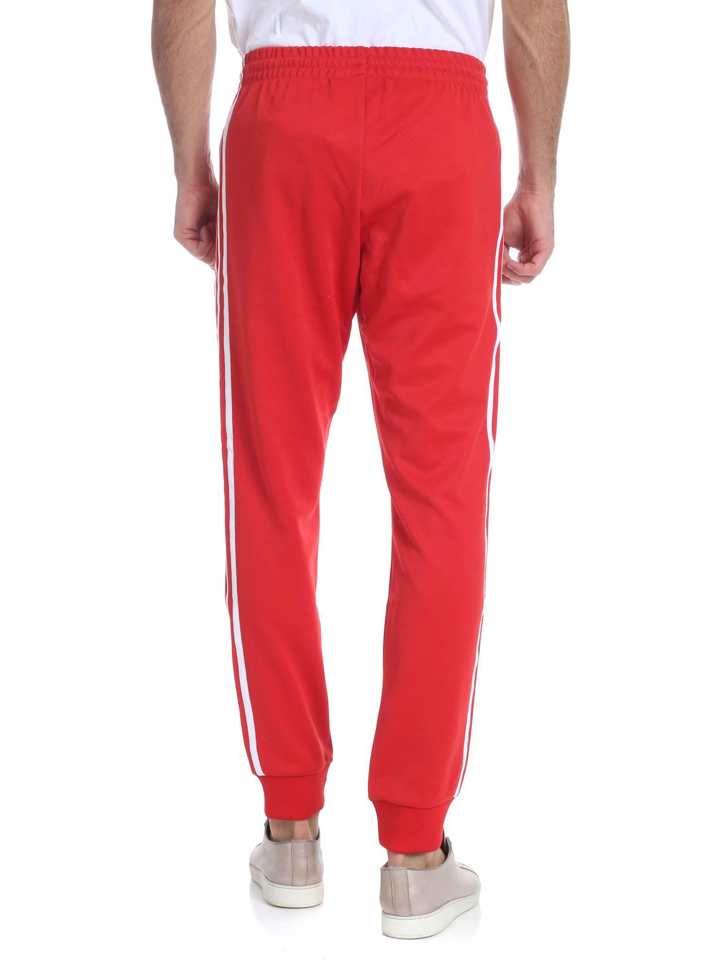red sst track pants