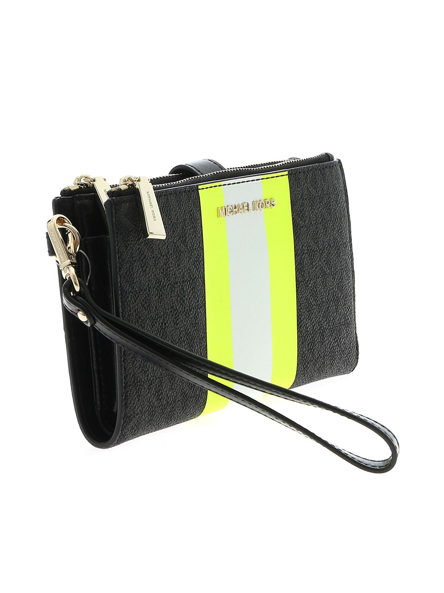 Michael Kors Wristlets Wallet In Black With Neon Yellow Detail - Lyst