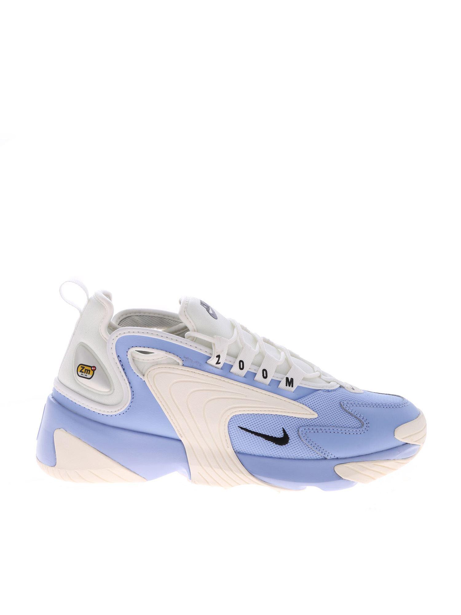 white and light blue nikes