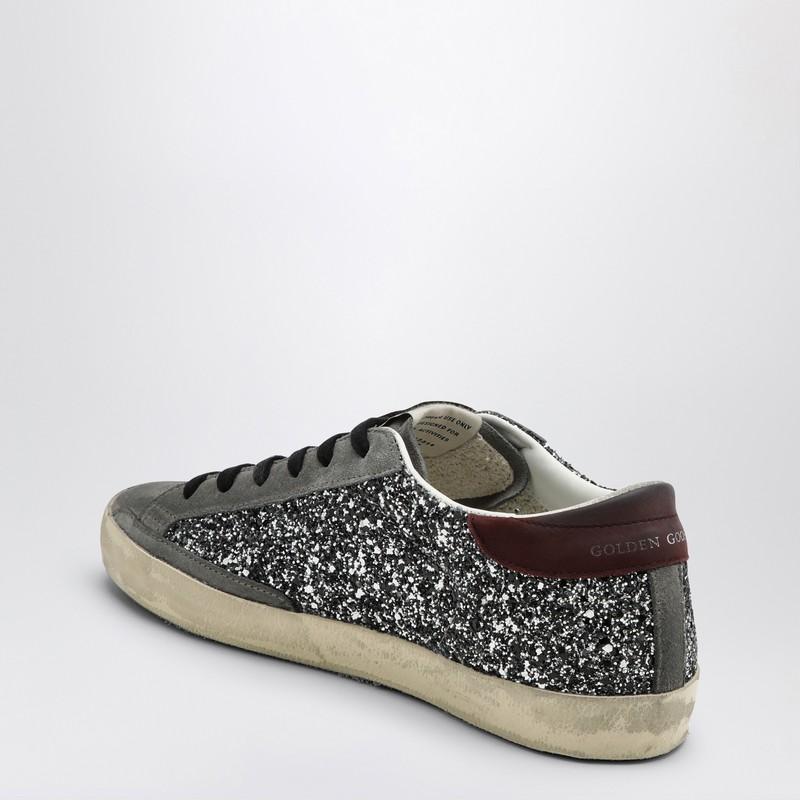 Sneaker super star argento/nera con glitter di Golden Goose in