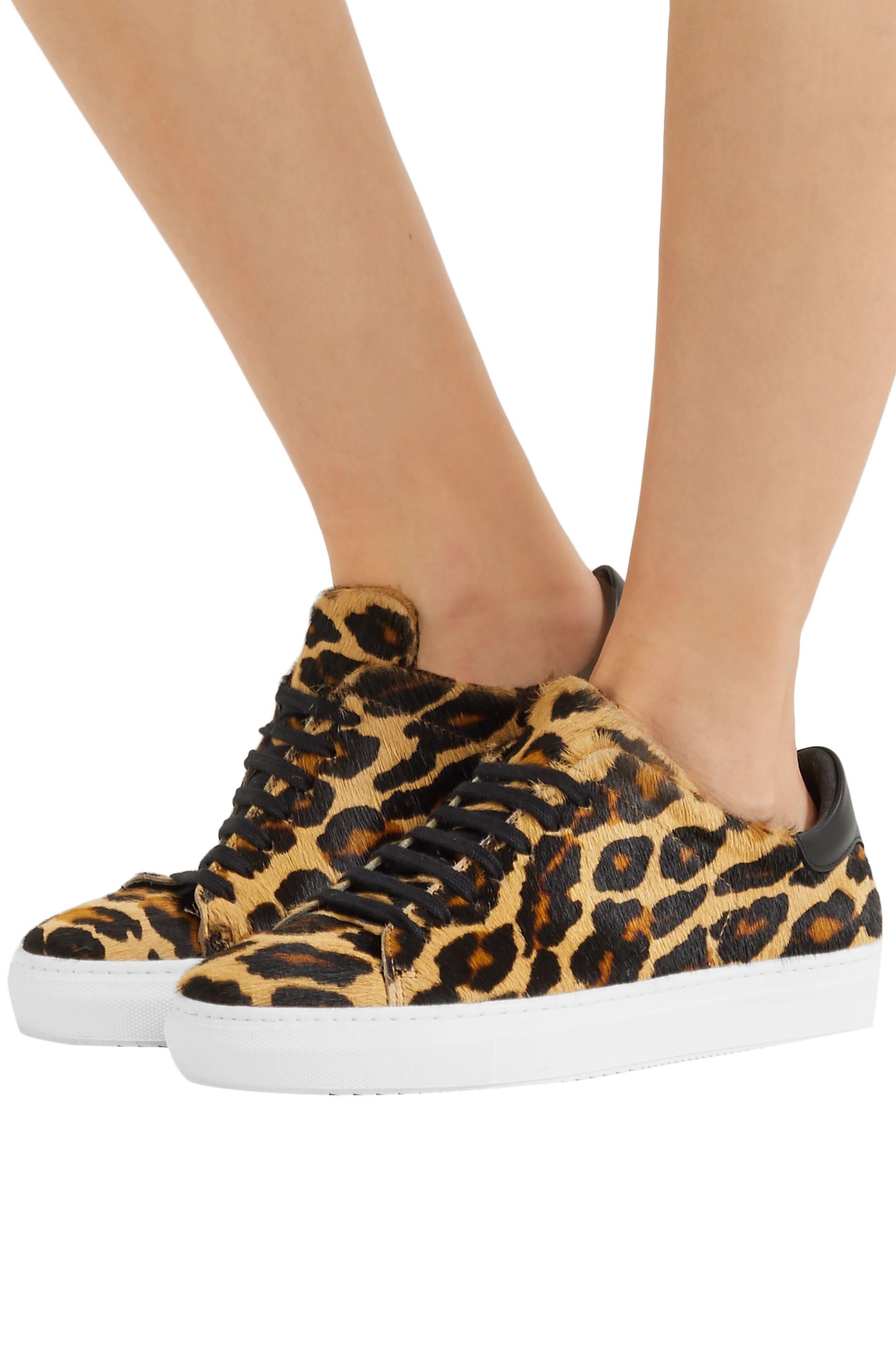 axel arigato leopard print trainers