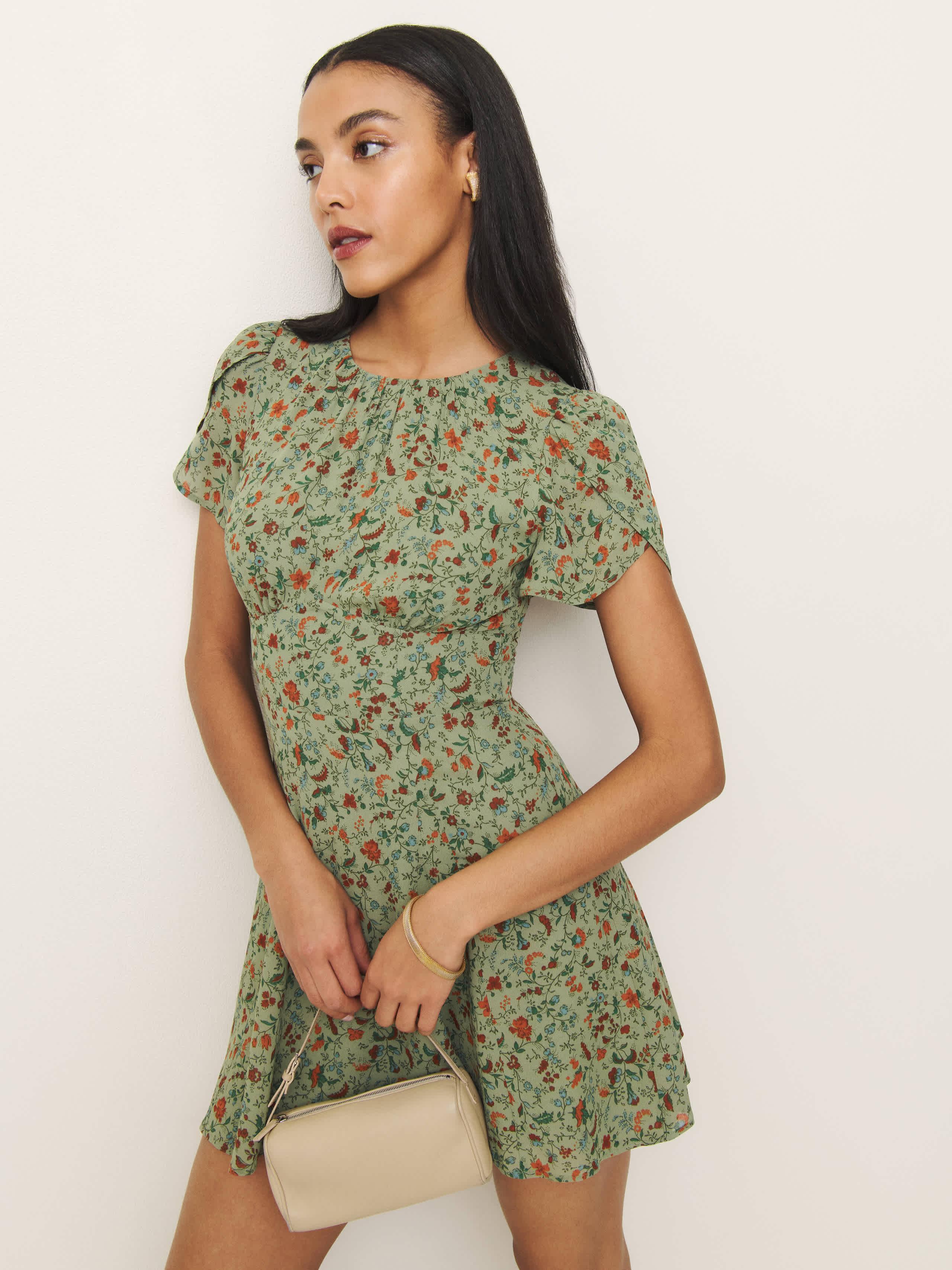 reformation green floral mini dress Reformation Mini Wrap Dress Green Ruffled Floral Print Crepe Size Extr –  Celebrity Owned main image 1
