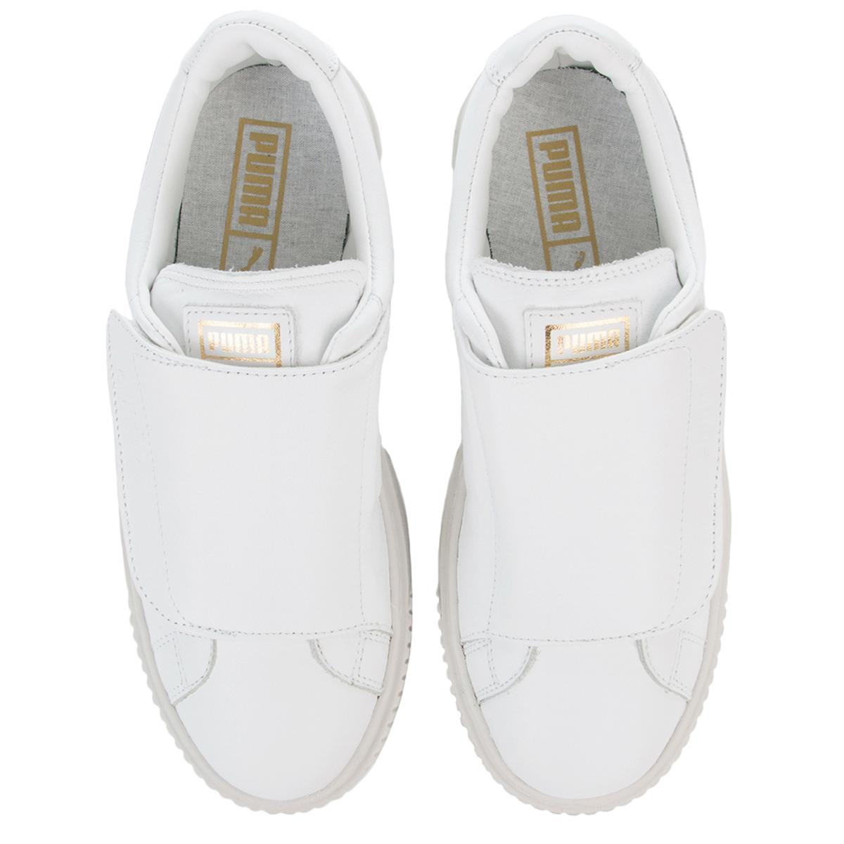 white puma velcro shoes
