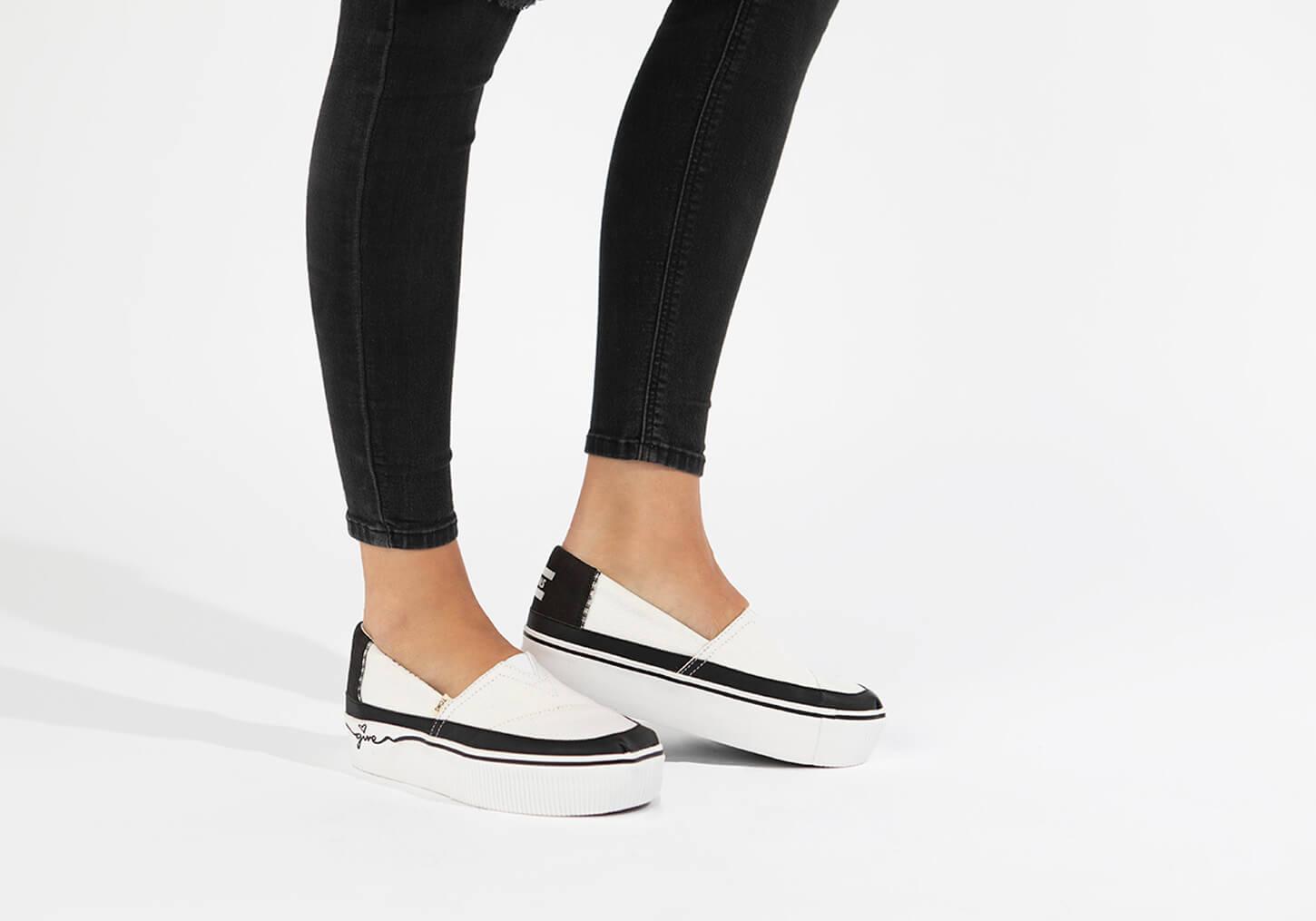 toms black on black heritage canvas