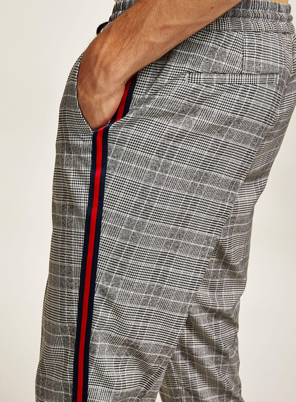 grey pants with red stripe