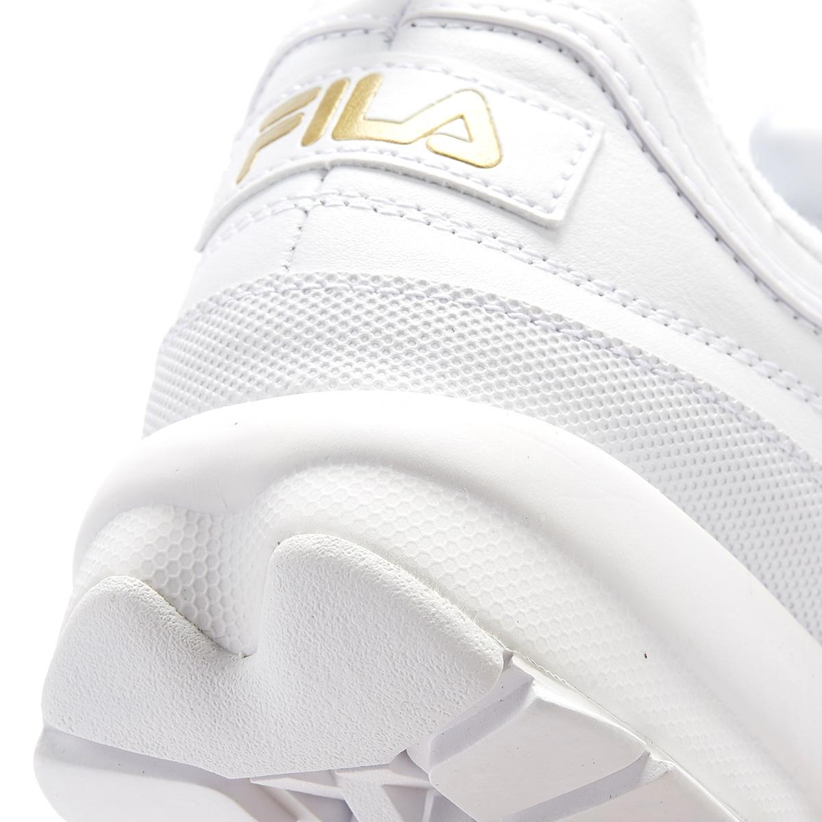 fila white and gold trainers