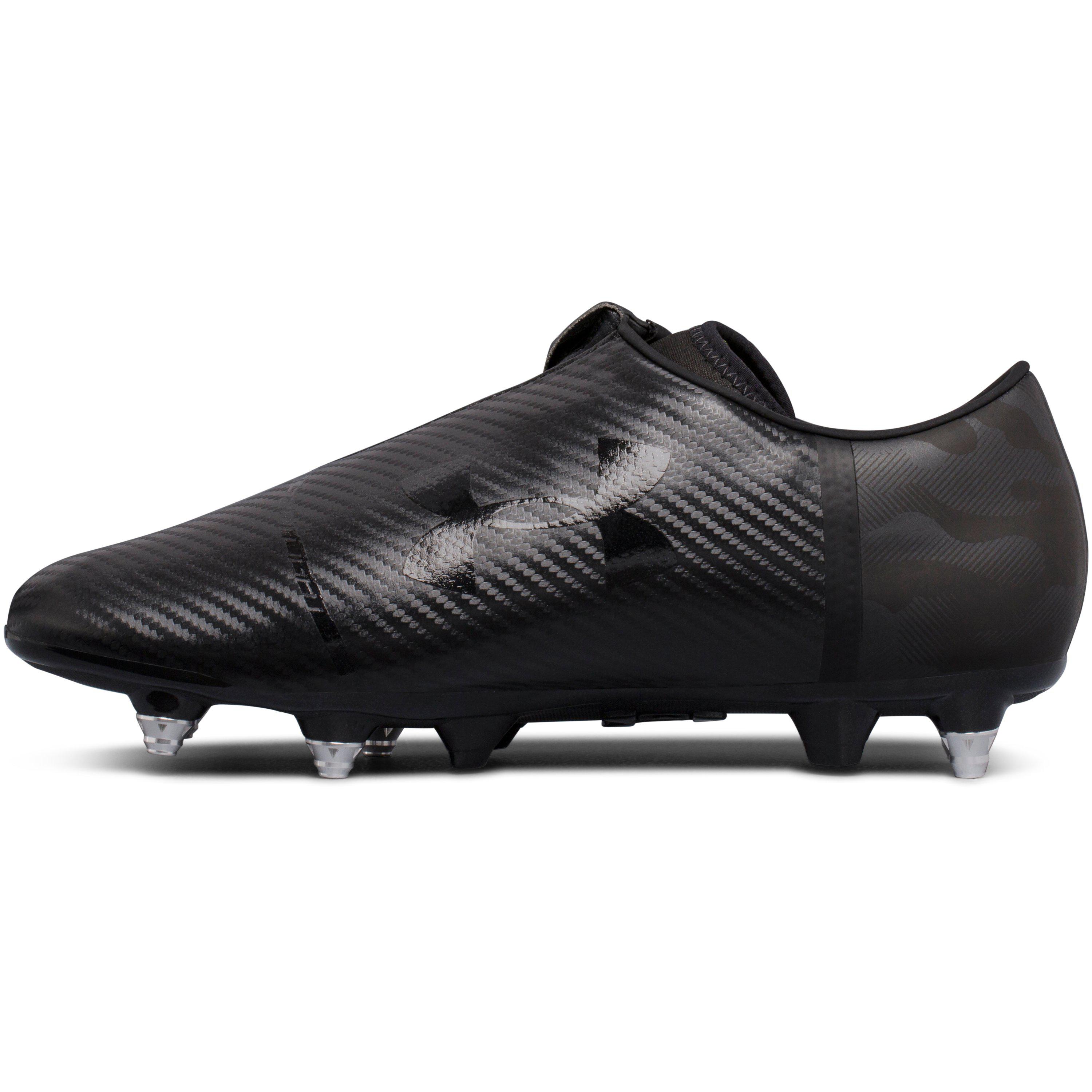 all black under armour spotlight cleats