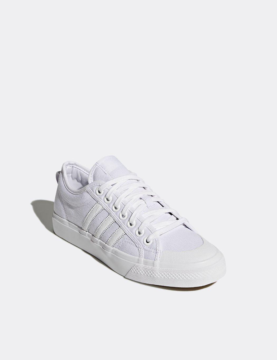white adidas canvas trainers