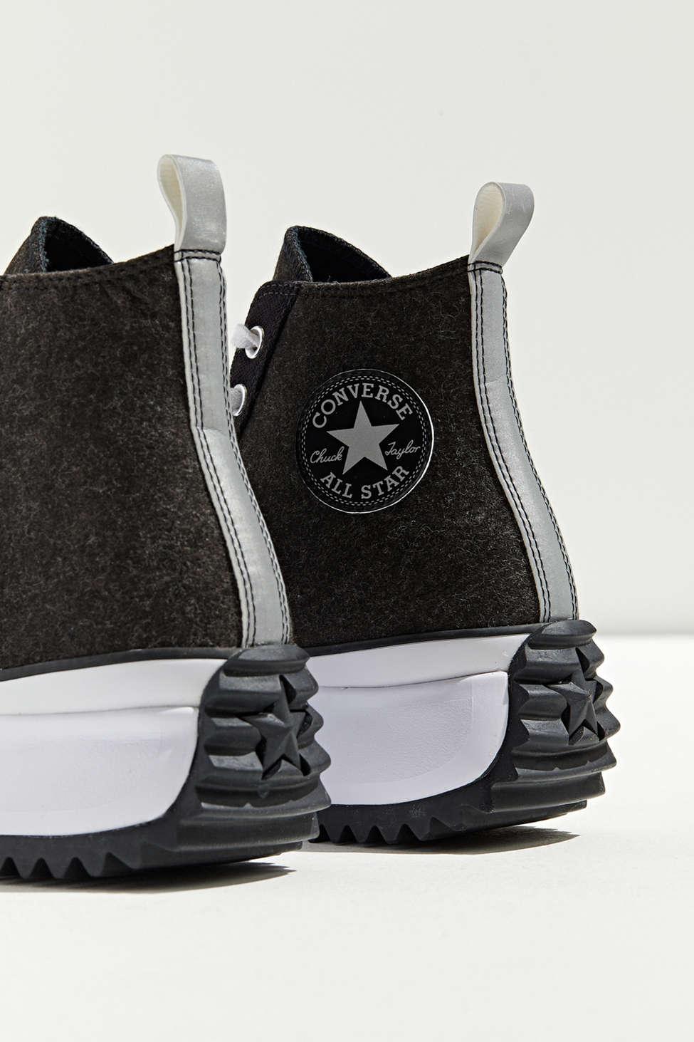 black run star hike high top sneakers