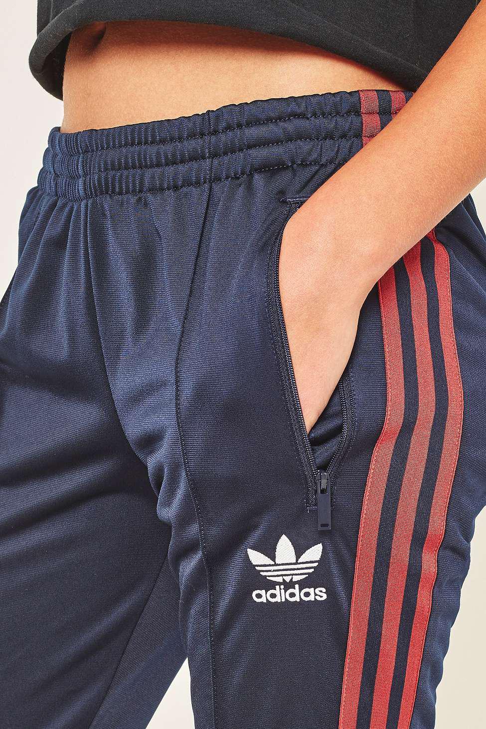 Navy blue track pants with red stripe sales
