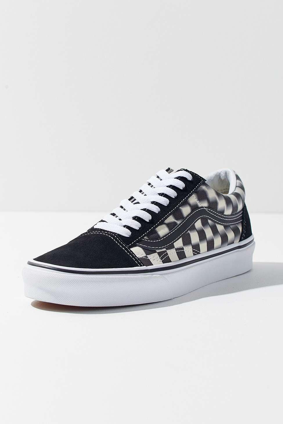 blurred checkerboard vans