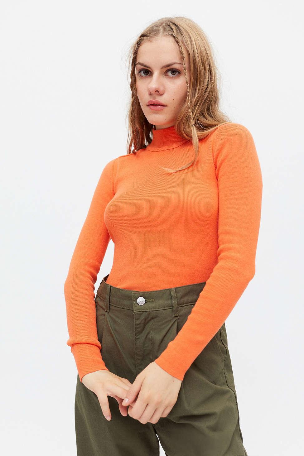orange turtleneck top