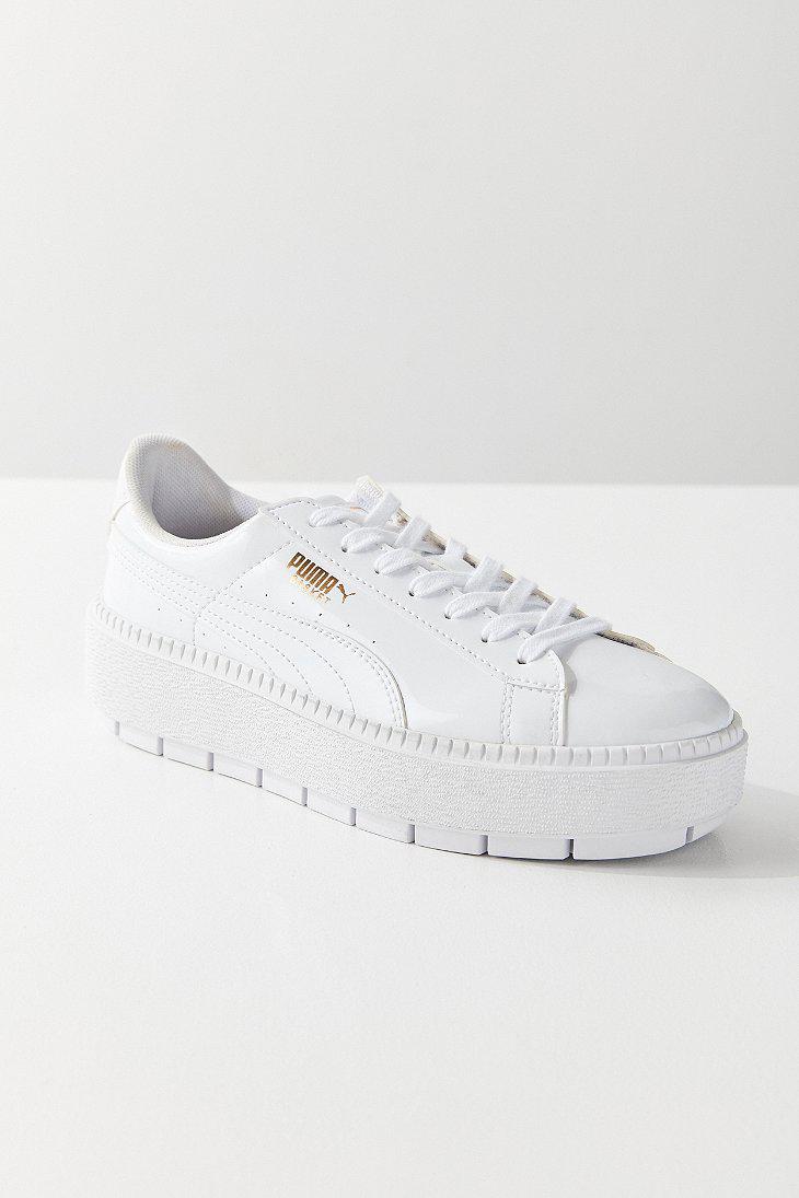 white puma platform trainers