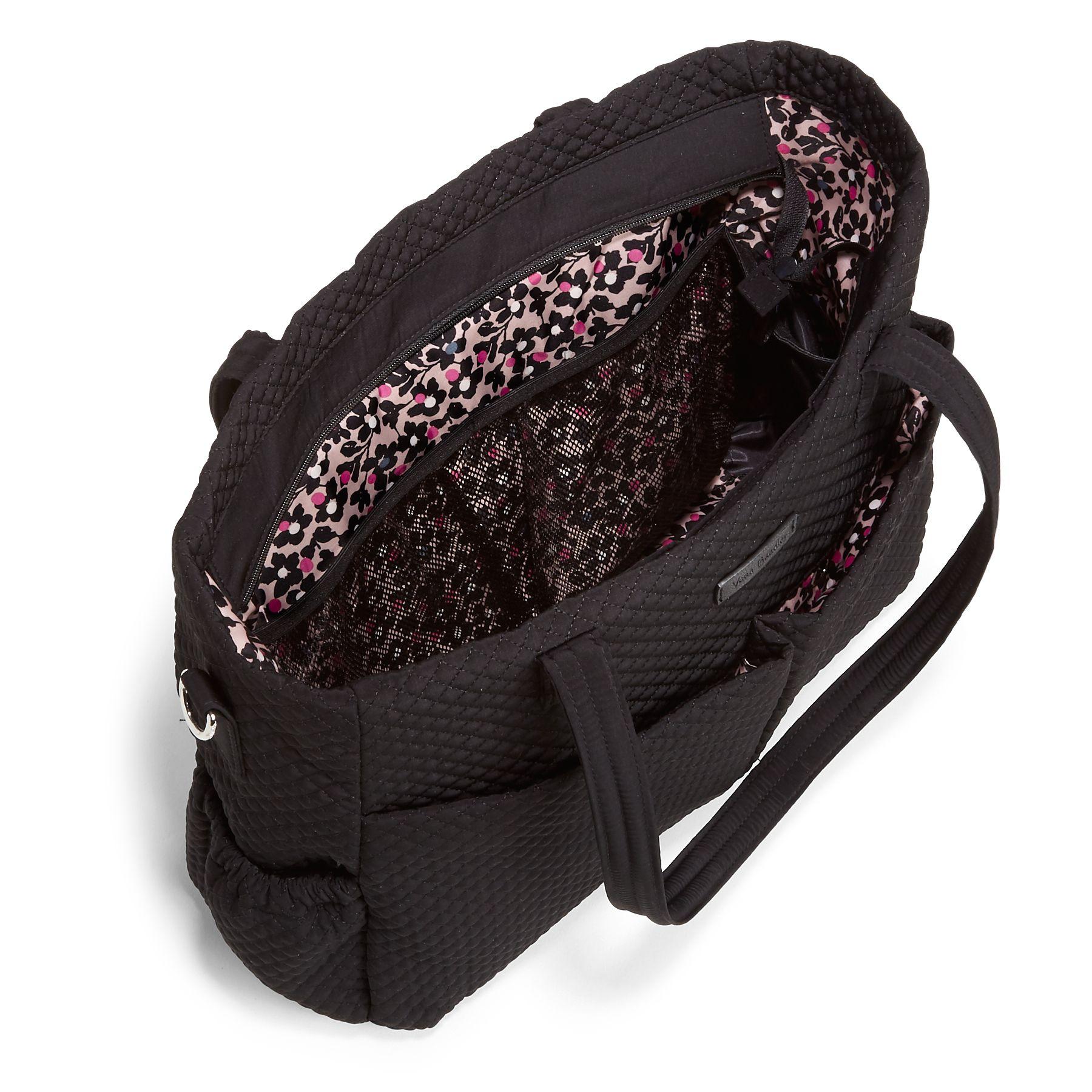 green and black diaper bag