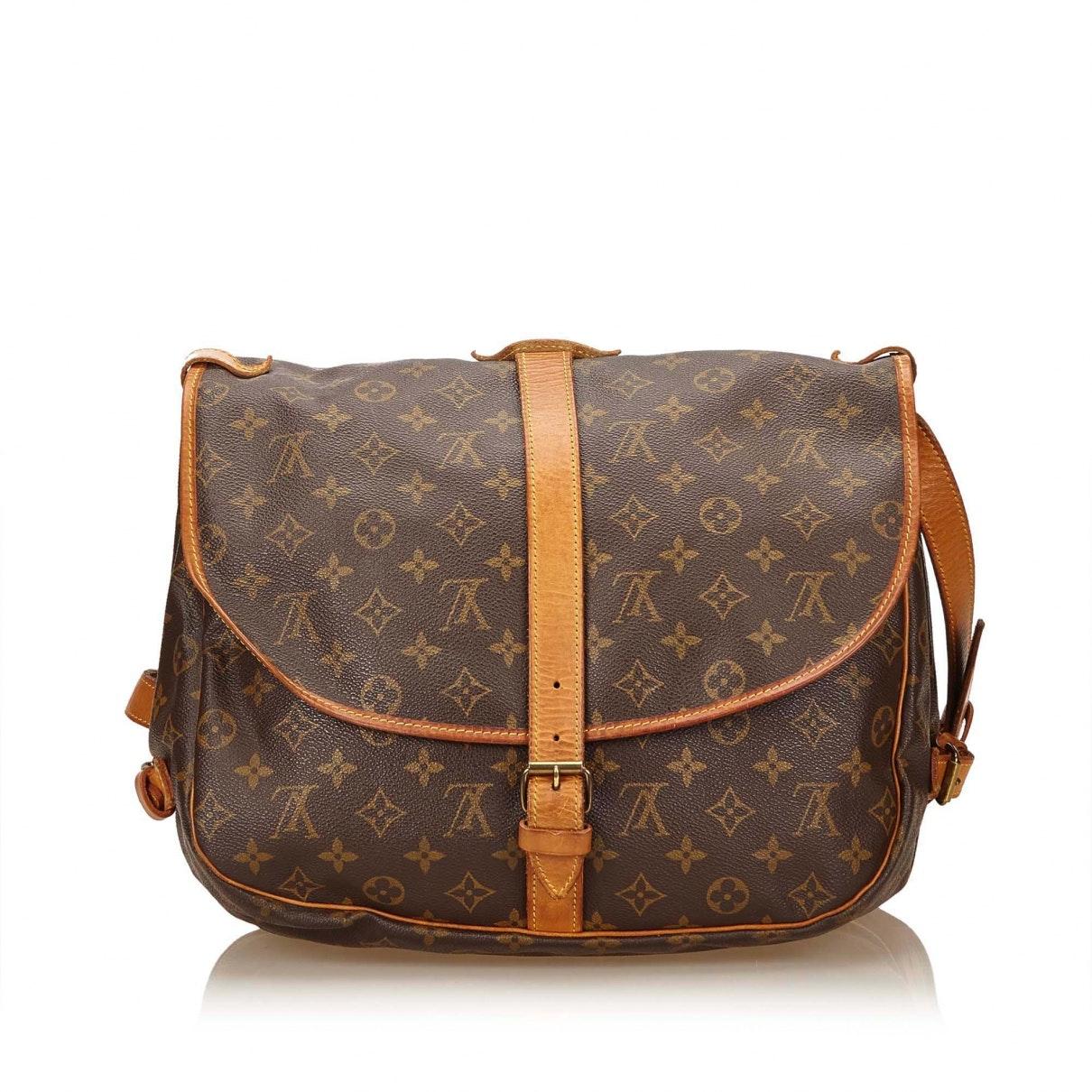 Louis Vuitton Canvas Pre-owned Saumur Cloth Handbag in Brown - Lyst