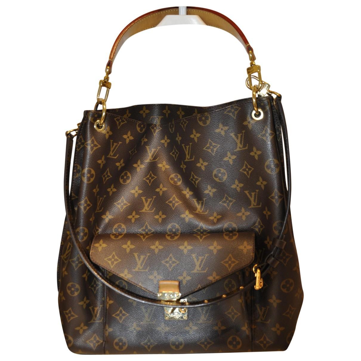 Louis Vuitton Pre-owned Metis Cloth Handbag in Brown - Lyst