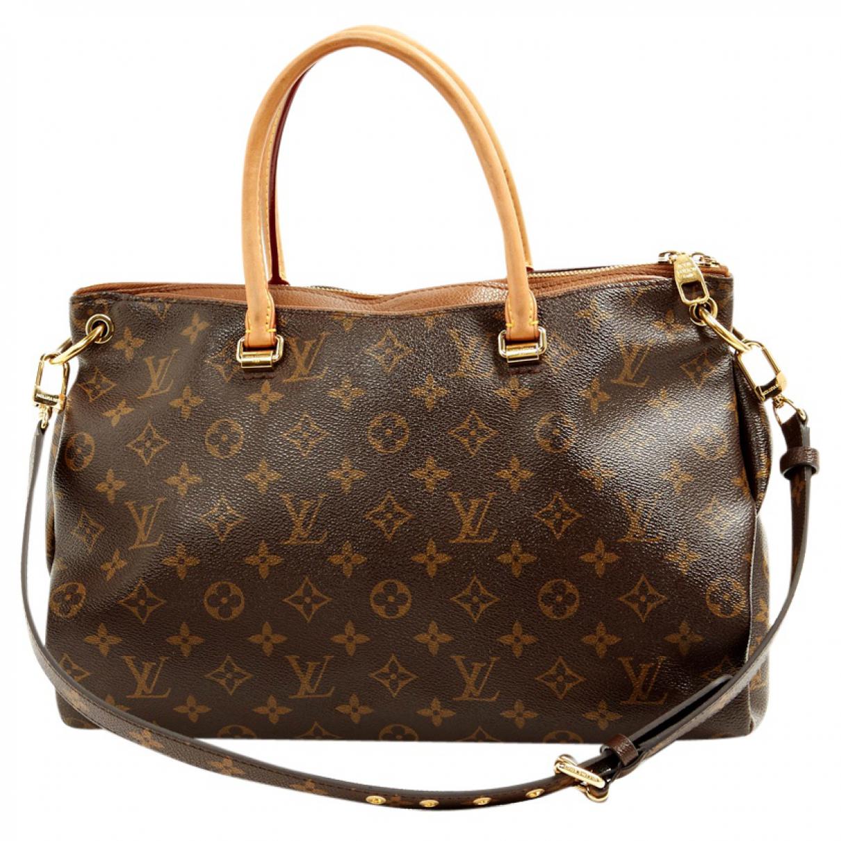 Lyst - Louis Vuitton Pre-owned Pallas Leather Handbag in Brown