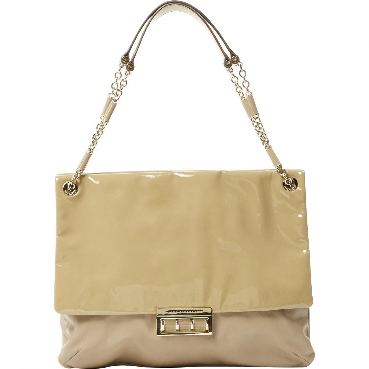 beige patent leather handbag