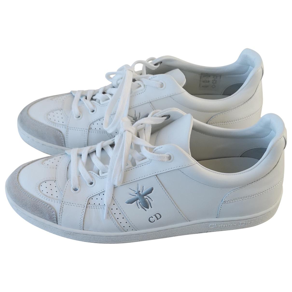 trainers with a bee logo