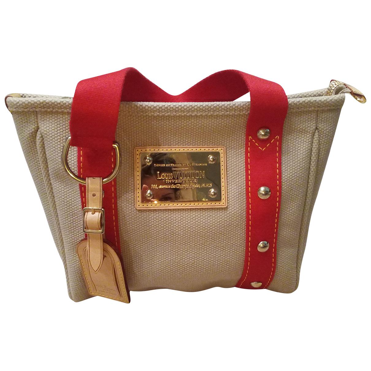 Louis Vuitton Cotton Antigua Handbag in Beige (Natural) - Lyst