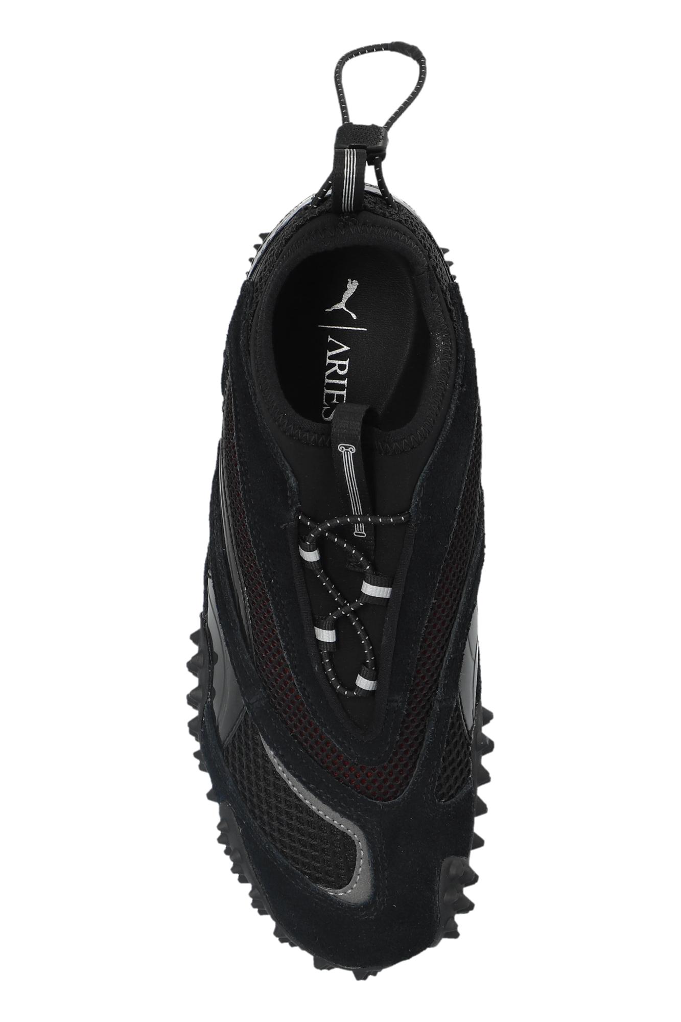 PUMA Sports Shoes Mostro Ac Aries Arise in Black for Men | Lyst