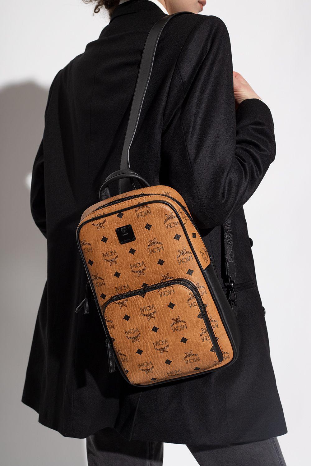 Mcm sling backpack hot sale