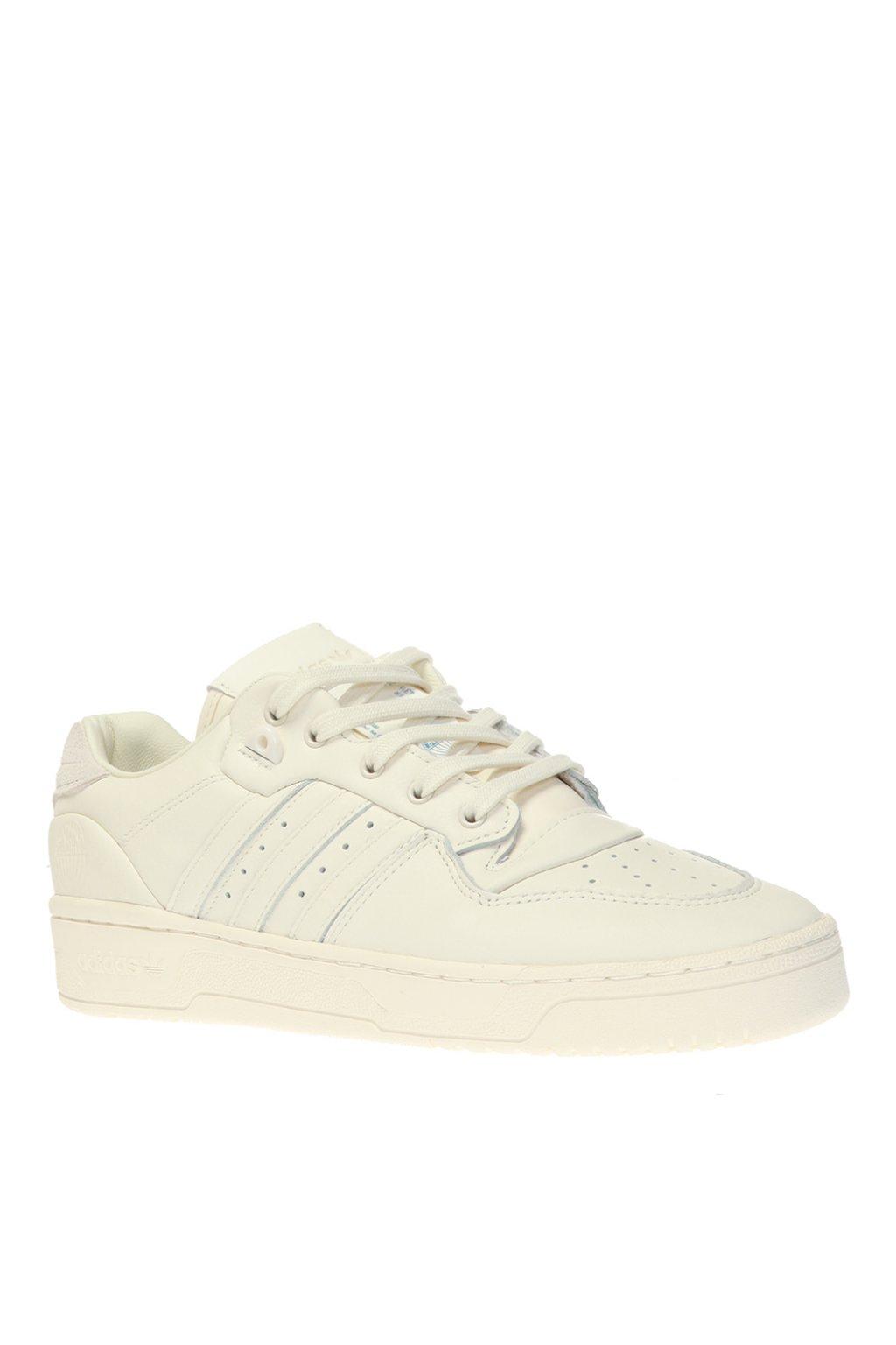 cream colored adidas sneakers