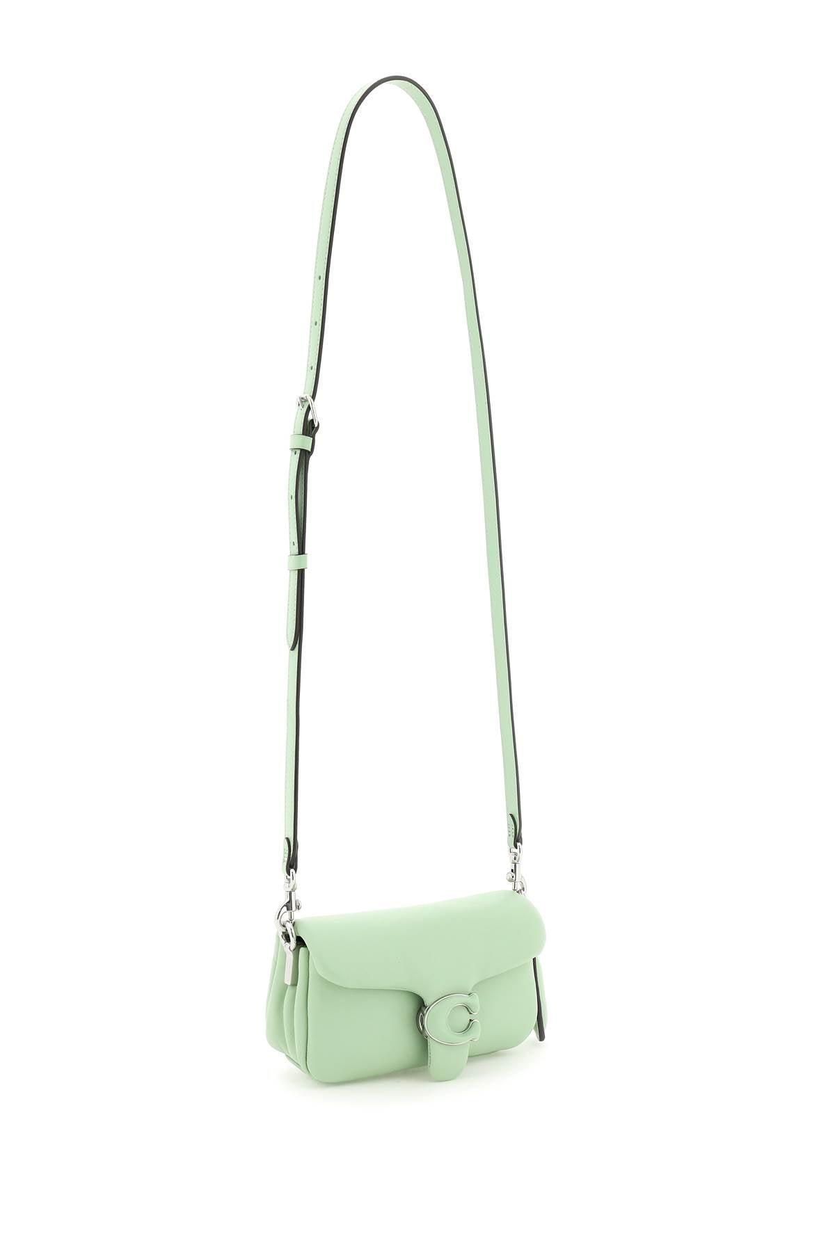 Coach lime green handbag with white leather straps.