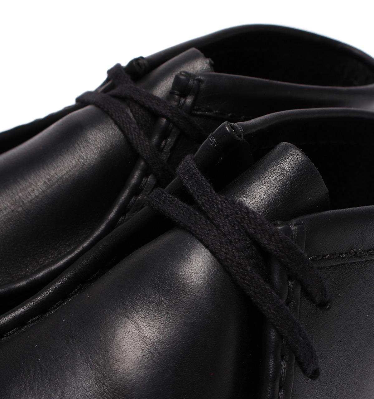 black leather wallabees