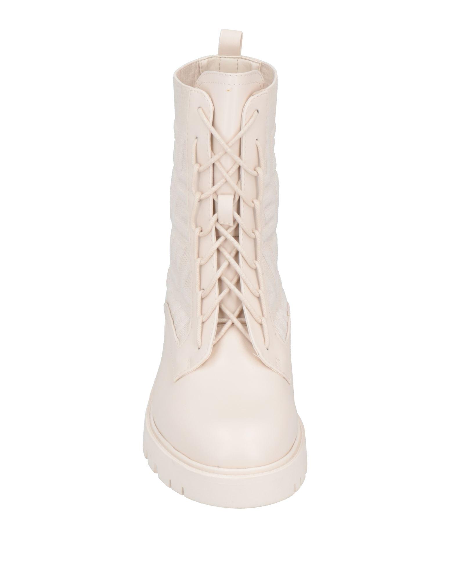 Guess Ankle Boots in Natural | Lyst