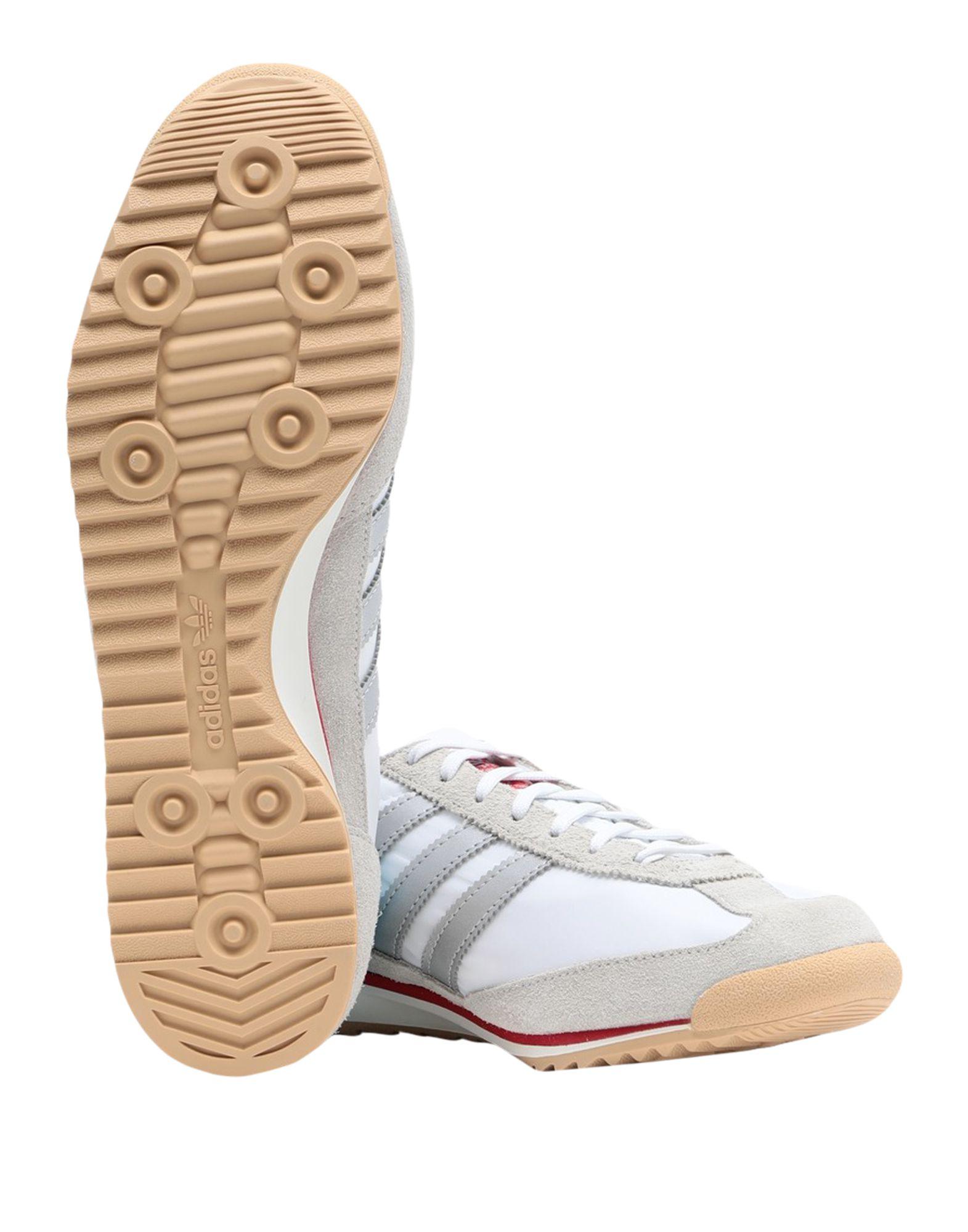 white adidas low tops