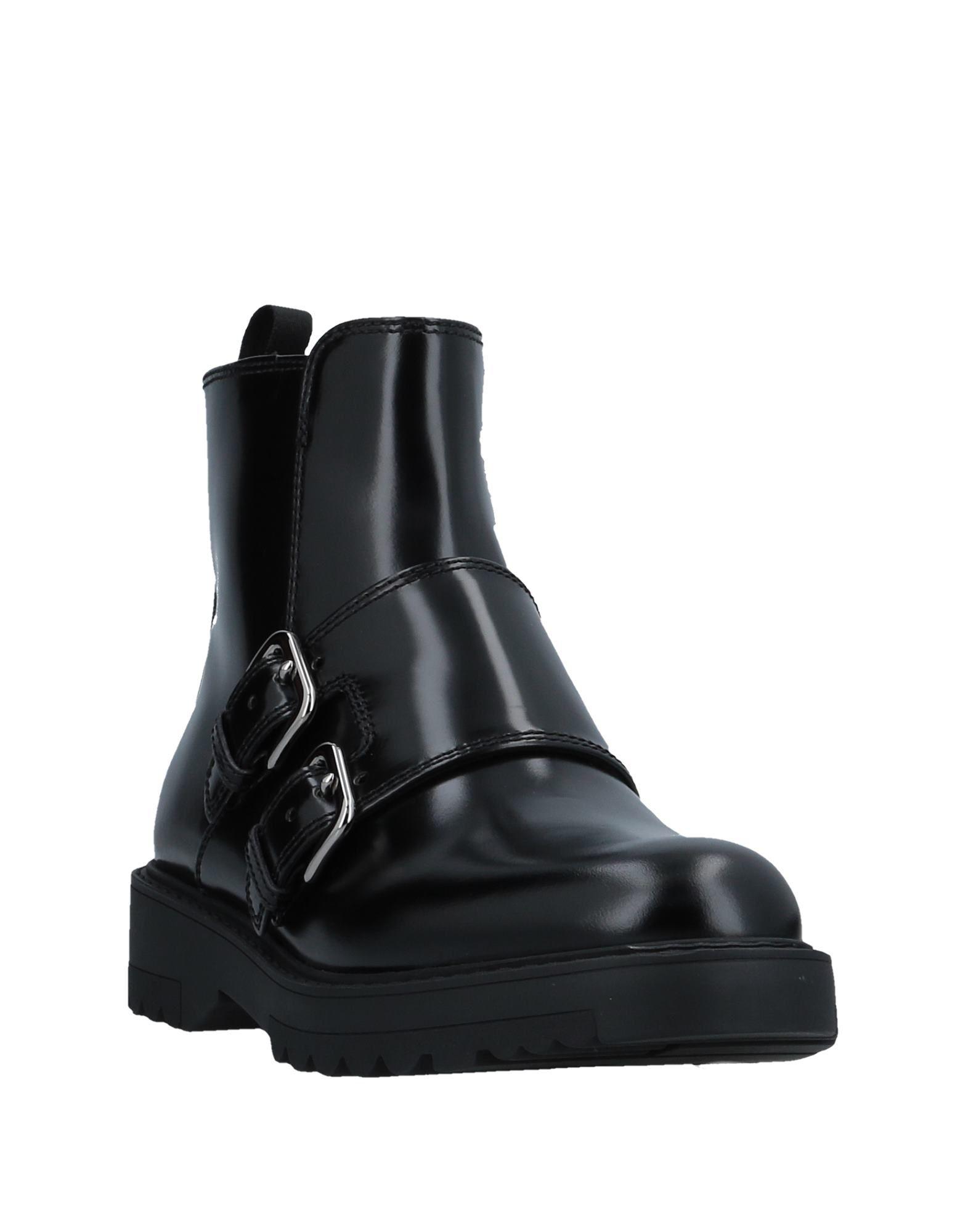 Prada Leather Ankle Boots in Black - Lyst