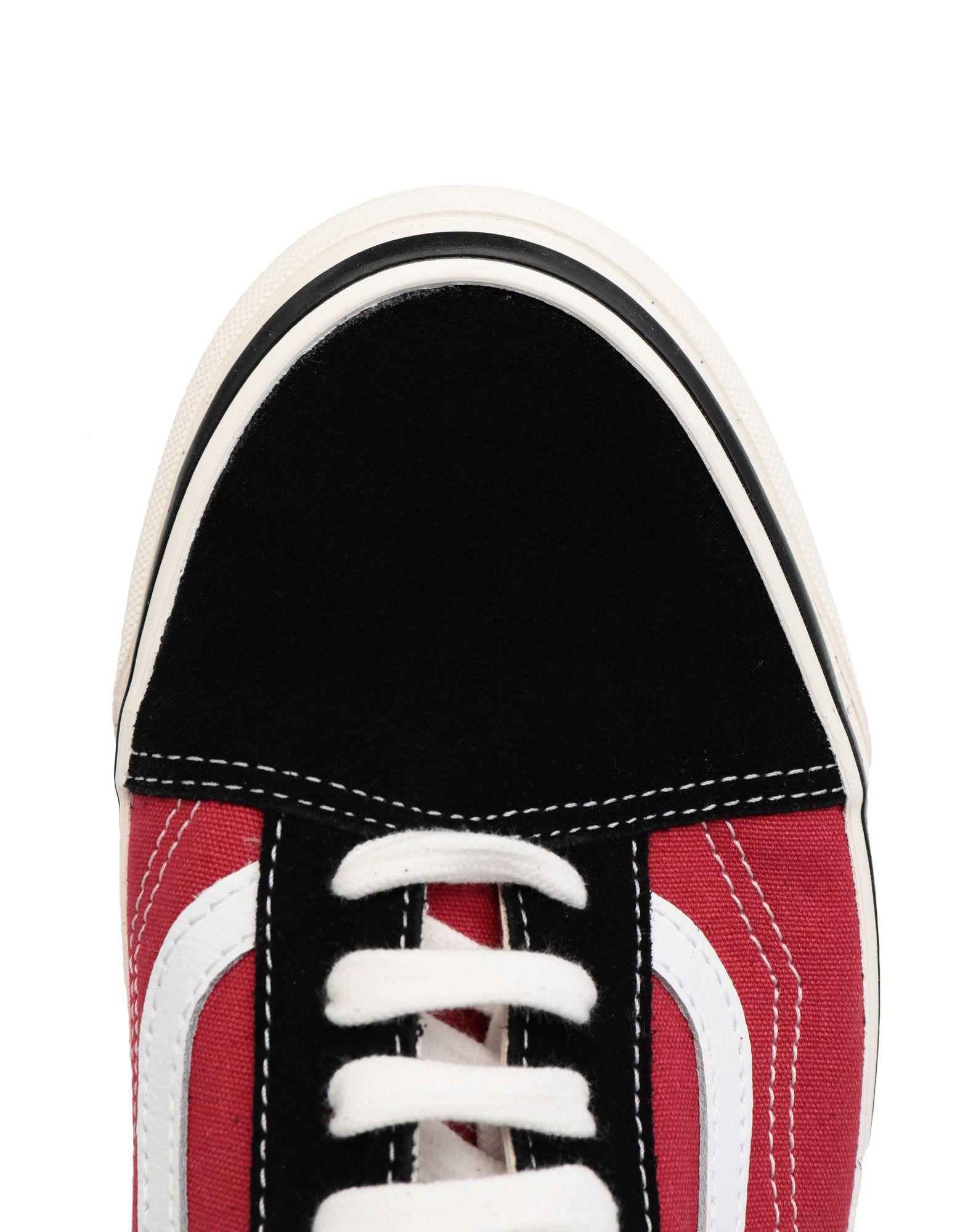 red and white low top vans