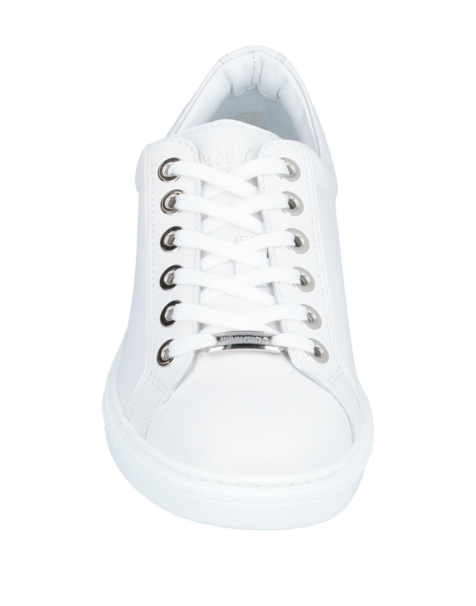 all white low sneakers