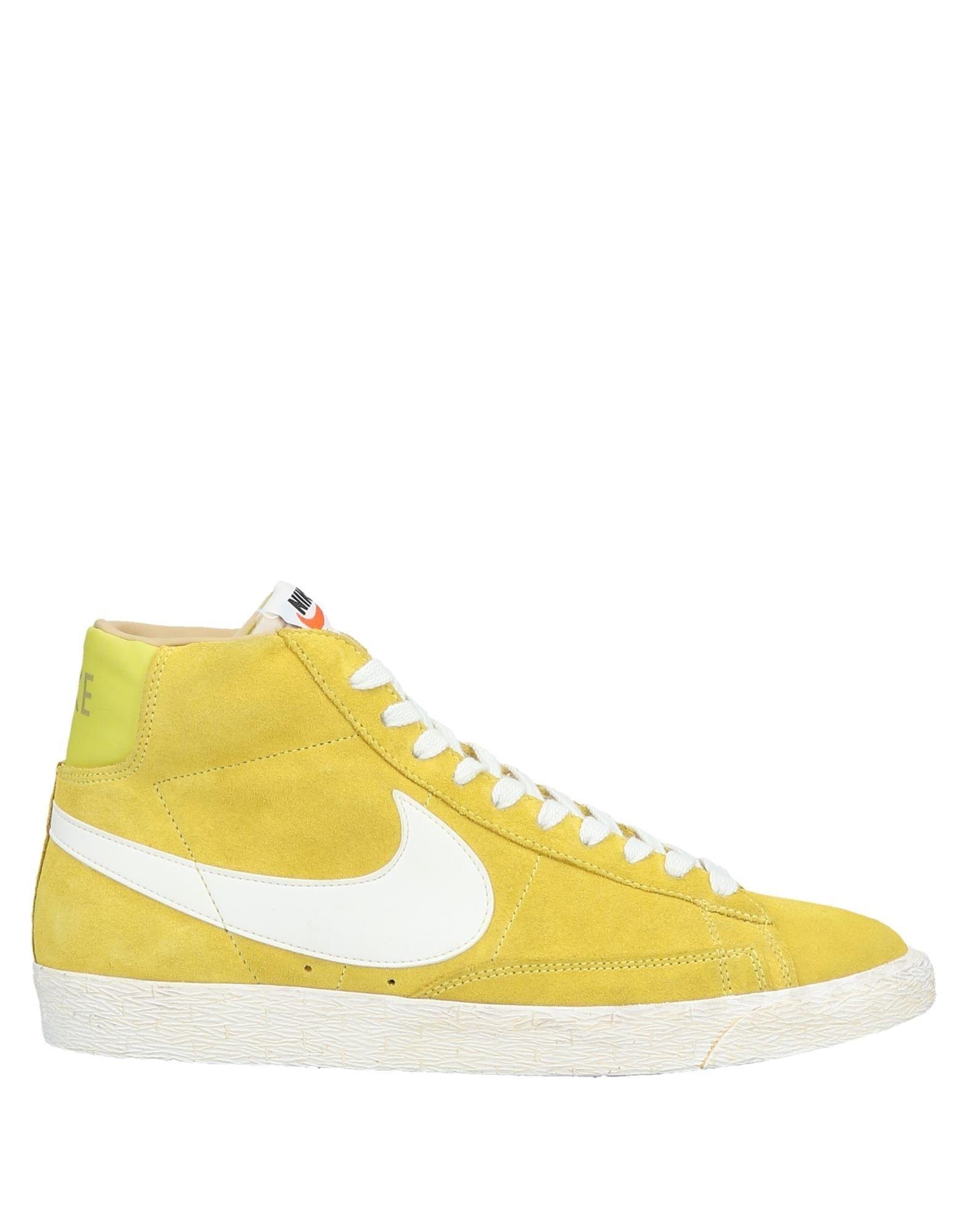 yellow high top nike shoes