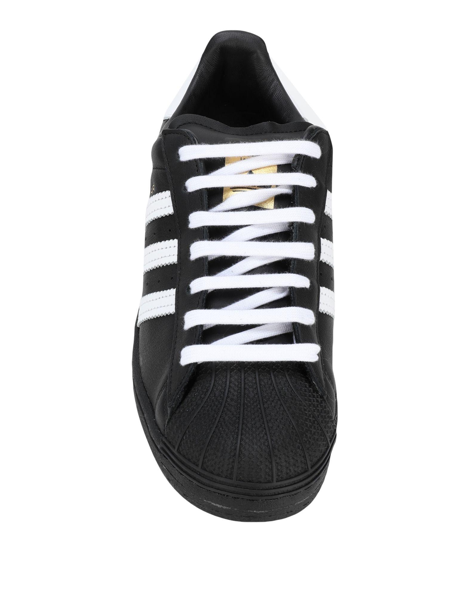 all black low top adidas
