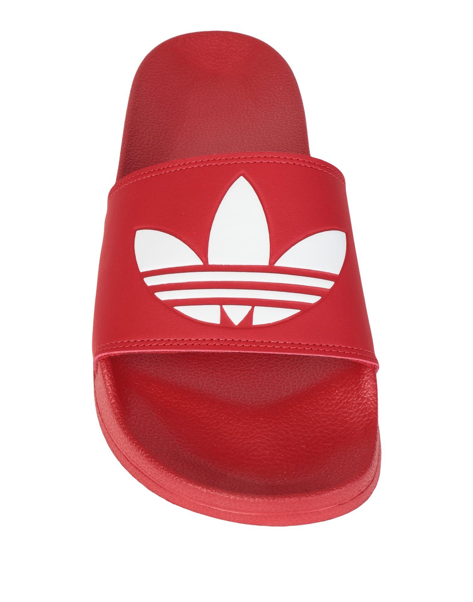 مسعف مخطوب بلوزة adidas adilette slides 