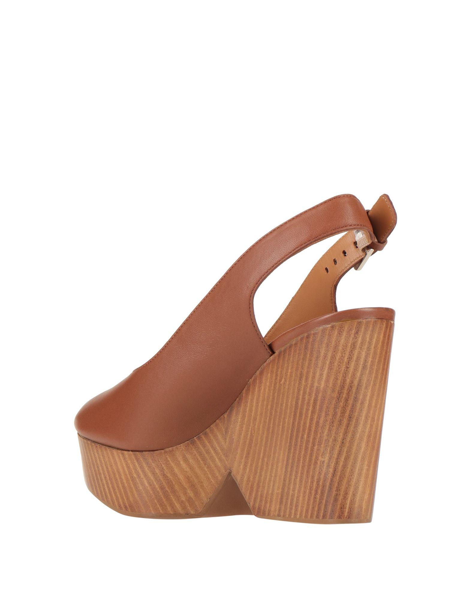 Robert Clergerie Mules Clogs in Brown Lyst