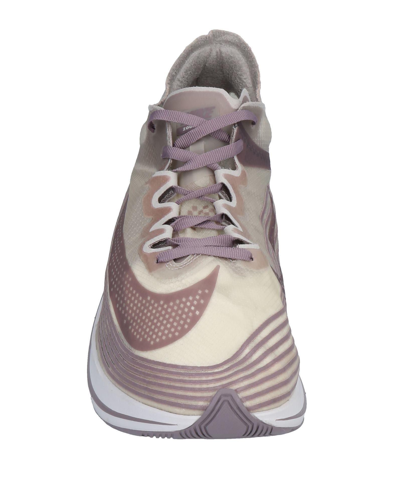 gray nike low tops