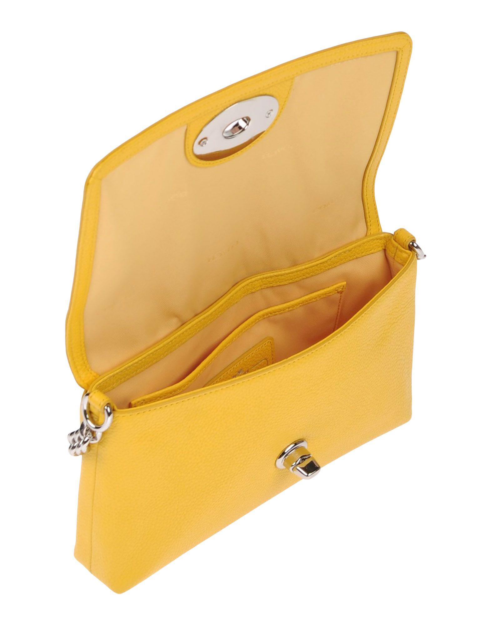 yellow cross body purse