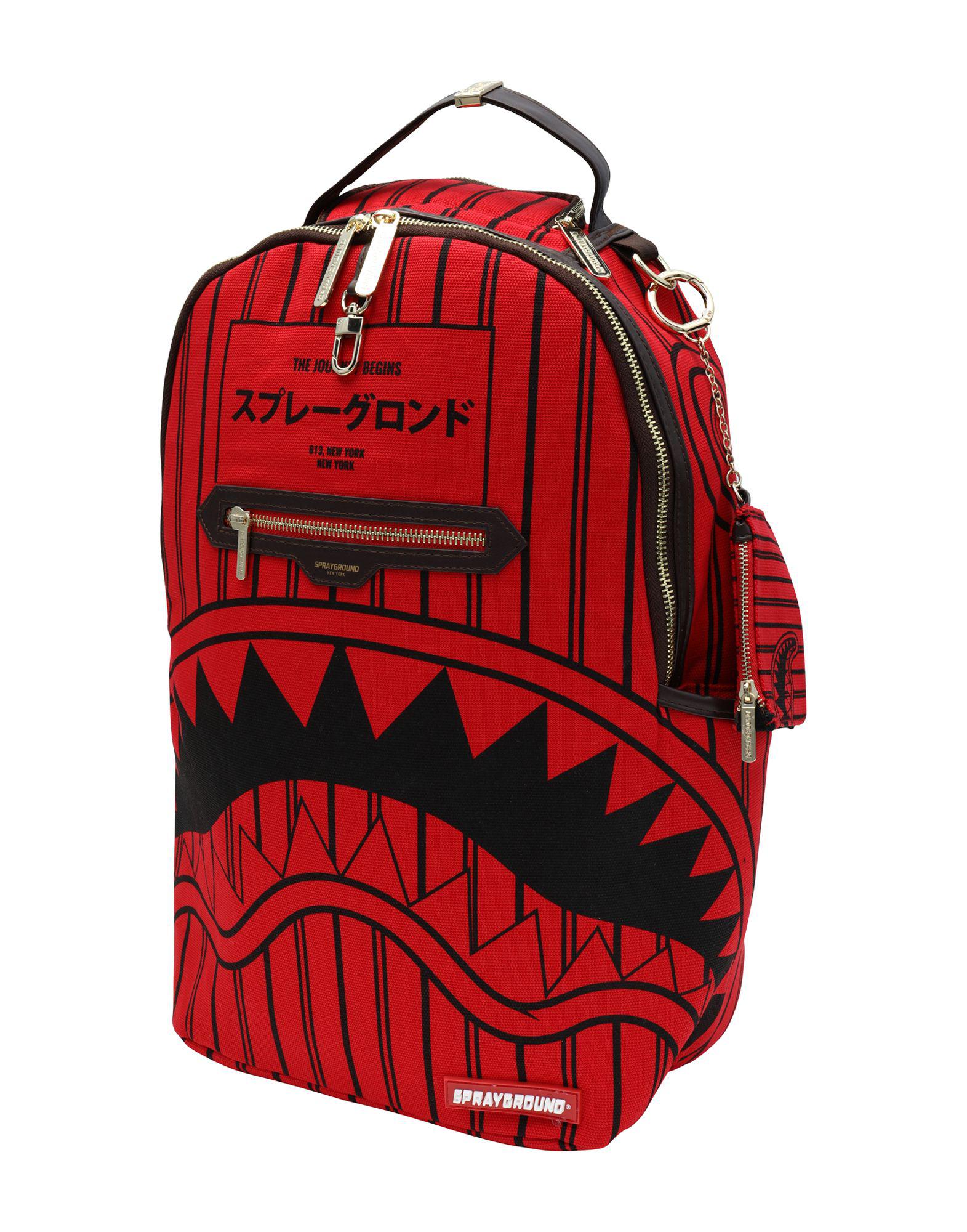 red sprayground bag