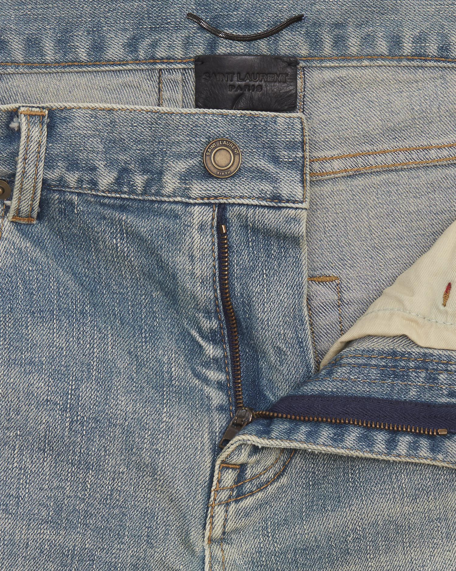 original low waisted destroyed skinny jean in dirty original blue trash denim