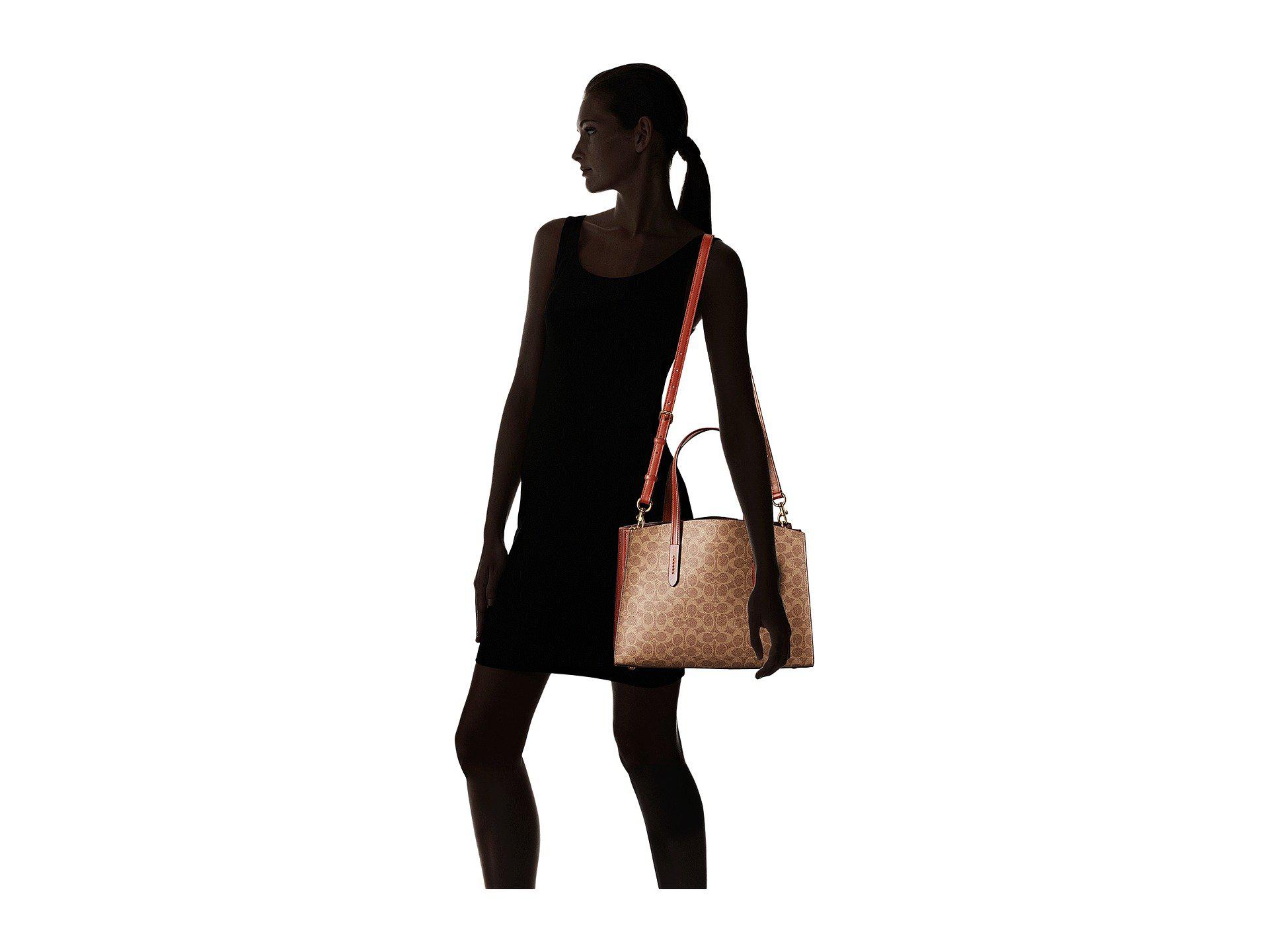 coach charlie carryall in signature canvas