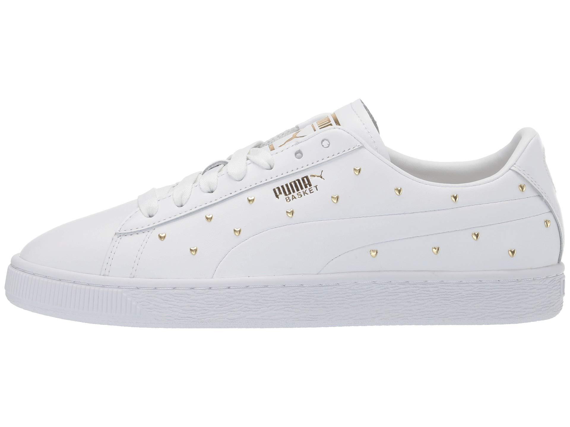 white and gold puma shoes